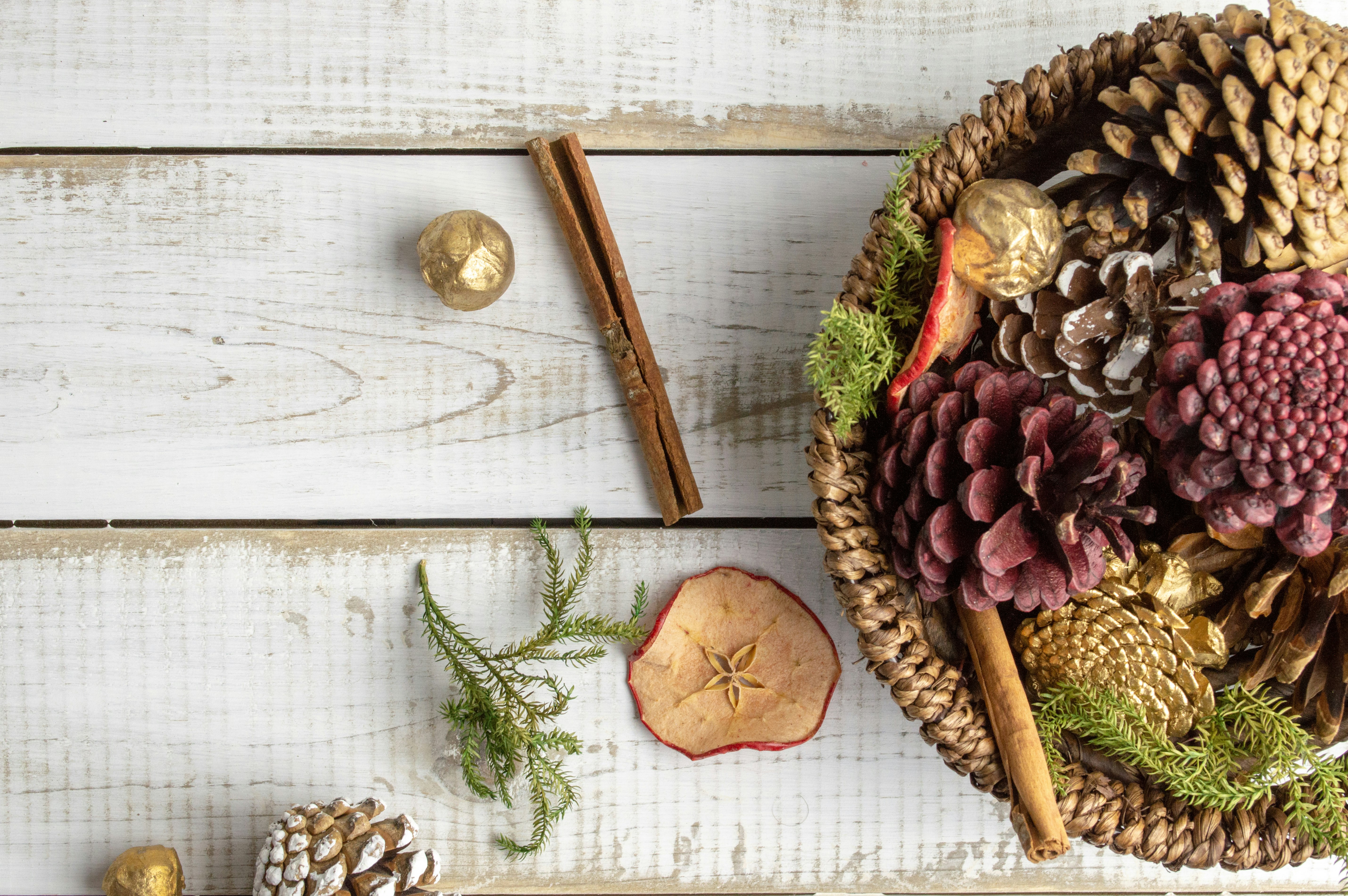 pine cone on round brown bowl